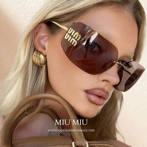 Miu Miu Black and Gold Sunglasses